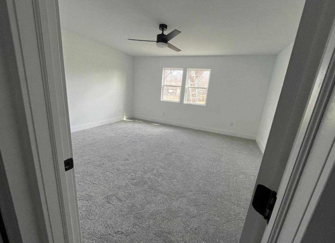 Rental bedroom painted with Behr Frost flat matte paint