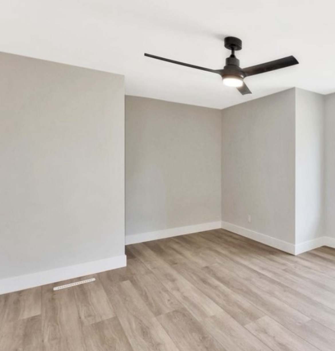 Renovated rental room with Sherwin-Williams Drift of Mist walls and Pure White trim